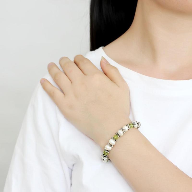 Antique Silver White Metal Bracelet with Synthetic Pearl in Olivine color